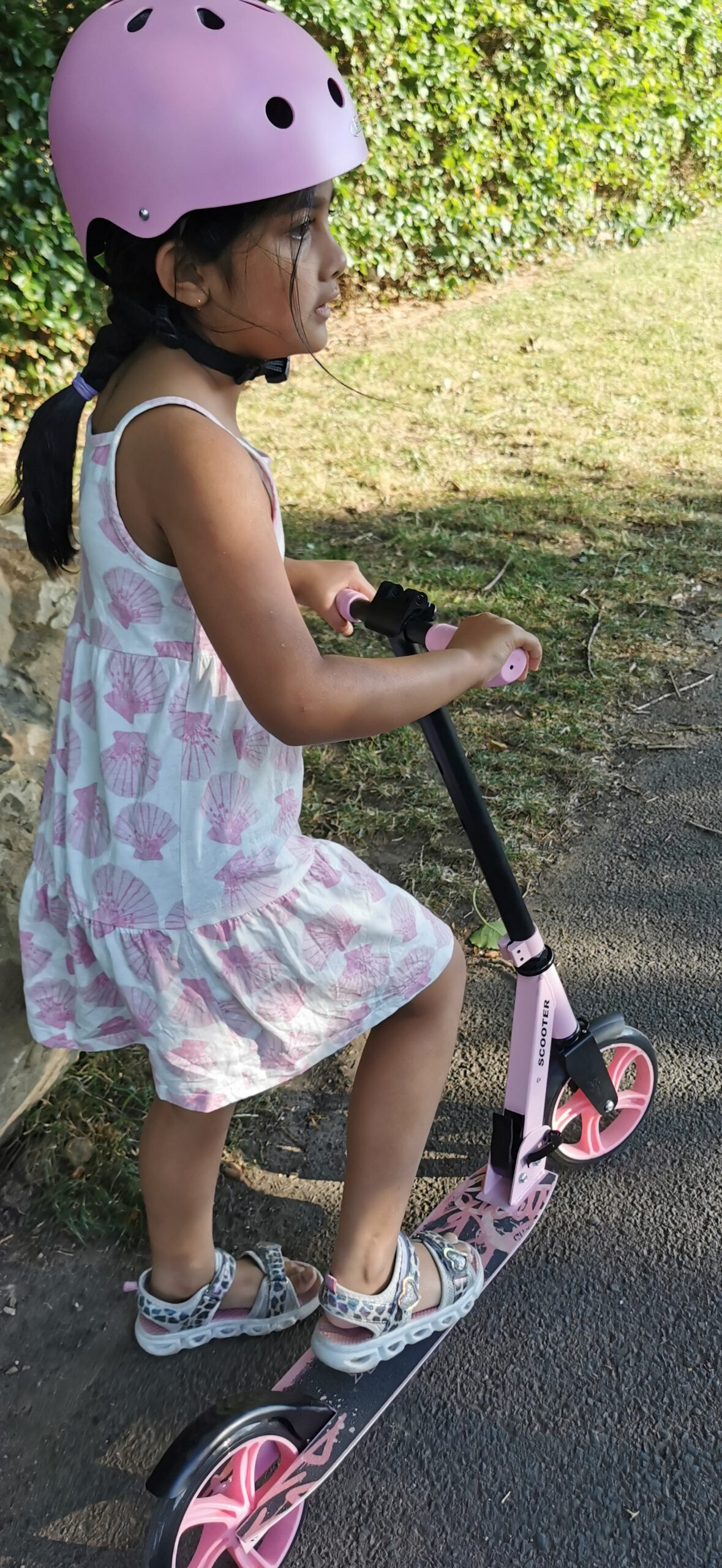 Girl riding Nattork Free Rush pink scooter on school run
